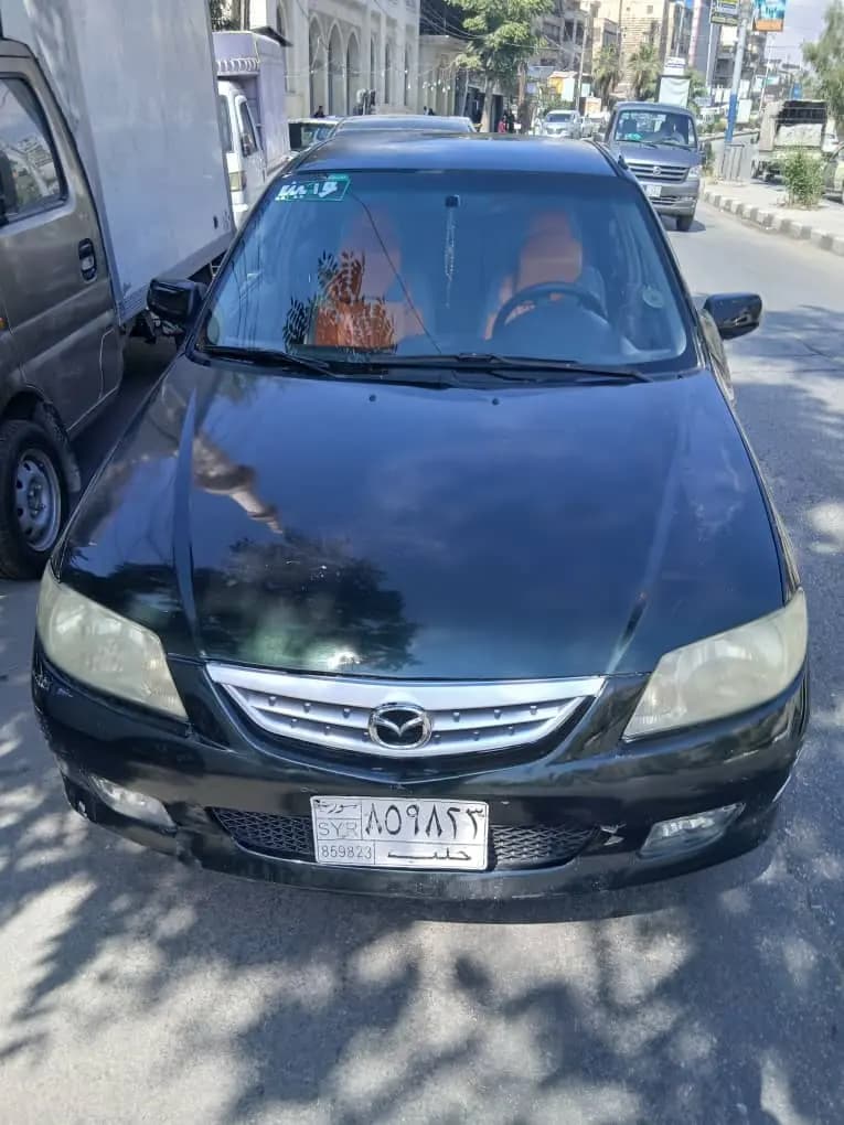 مازدا 323 موديل 2002 بحالة جيدة