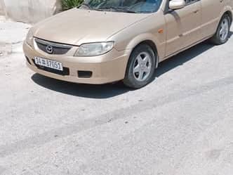 مازدا 323 2002
